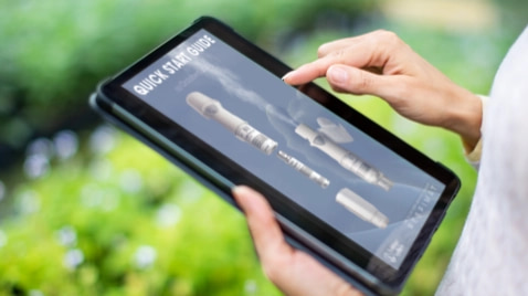 patient on tablet looking at stiolto quick start guide