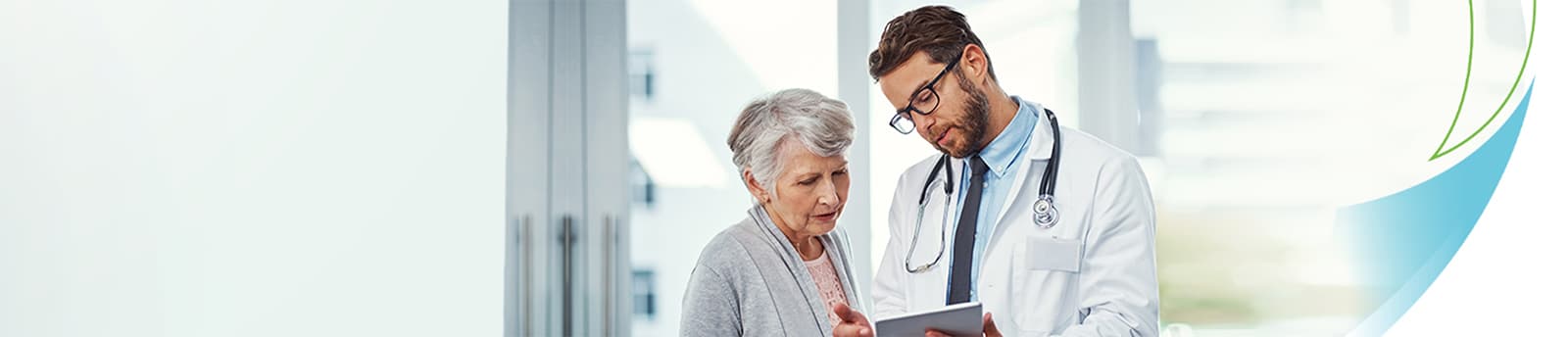 male doctor and senior female patient